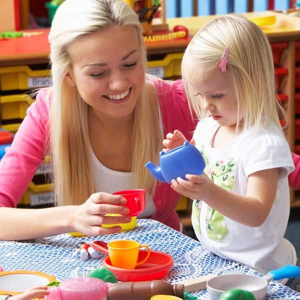 adult and child playing tea party