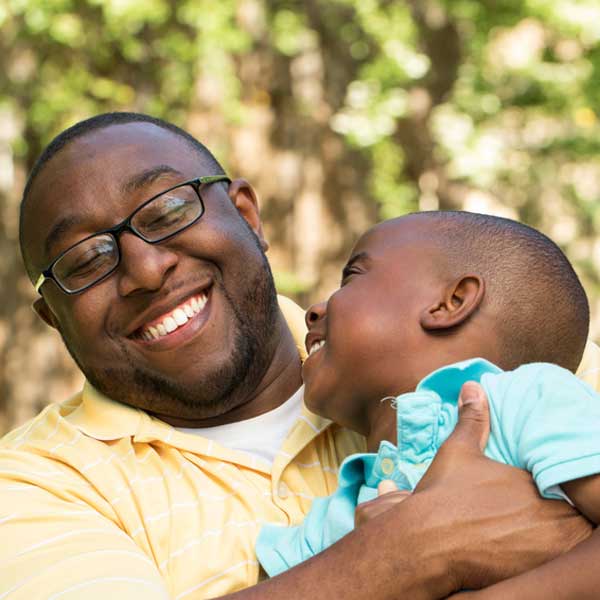 father and son laughing together