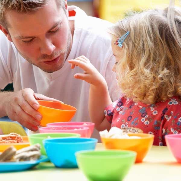 playing with bright coloured cups